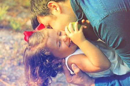 Father embracing his child